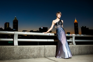 Roswell High School Senior girl takes the night by storm with her prom dress and Atlanta skyline. Images by Urban Flair Photography